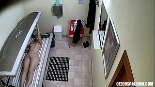 Older MILF Tanning her Shaved Tight Pussy